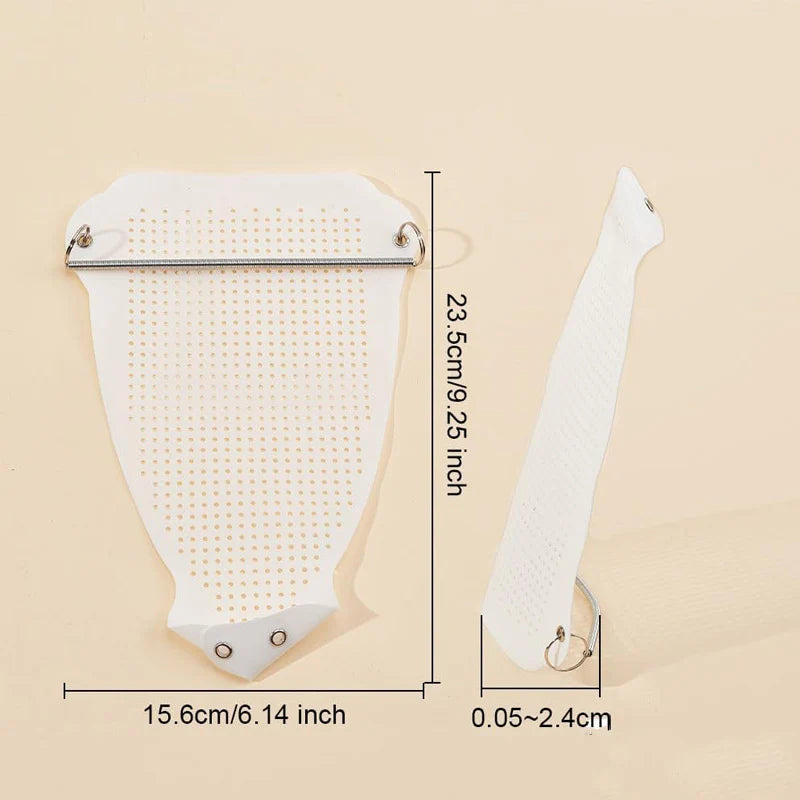 White hairbrush with measurements on a beige background