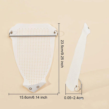 White hairbrush with measurements on a beige background